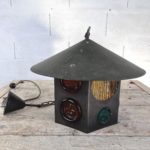 Metal and colored glass lantern by Erik Hoglund