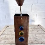 Square copper suspension with colored glass cabochons by Erik Hoglund
