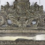 Large empire style repoussé metal mirror