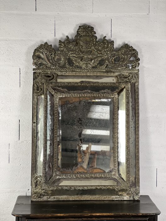 Large mirror in embossed metal