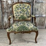 Armchair with flat back covered with tapestry